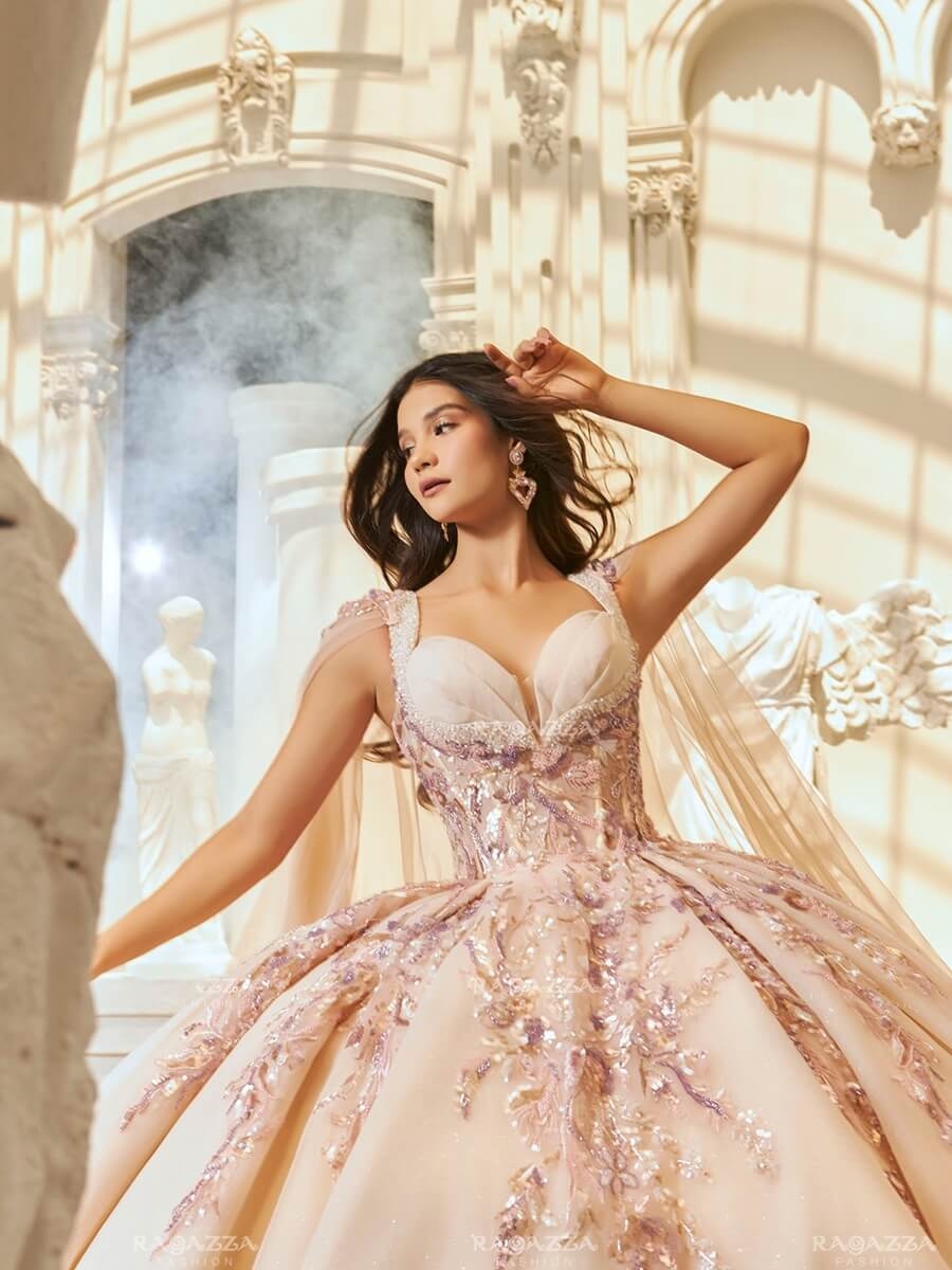 Photo of the model wearing a light rose gown